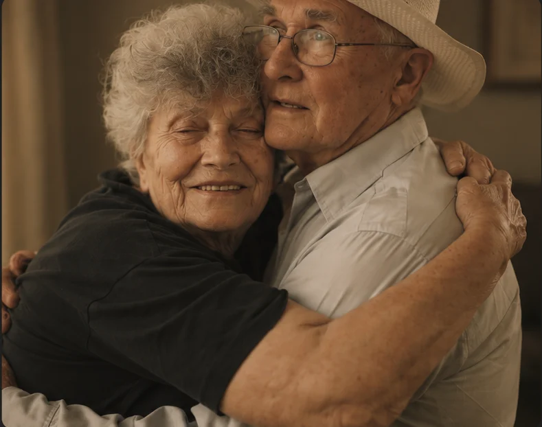 An older couple embracing.